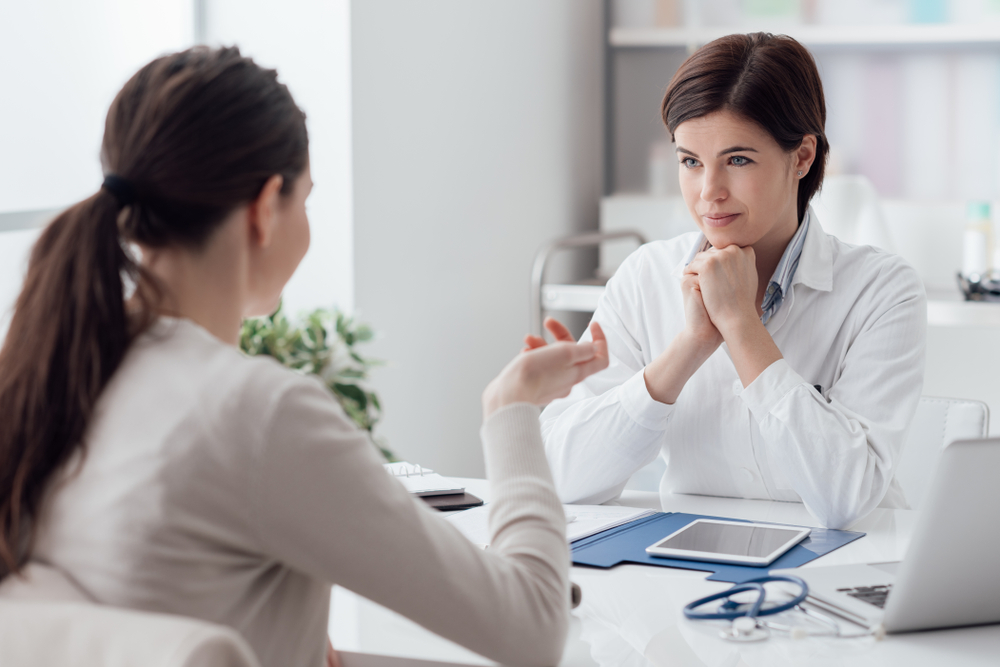 woman talking to doctor.
